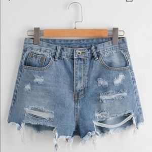 Distressed denim shorts
